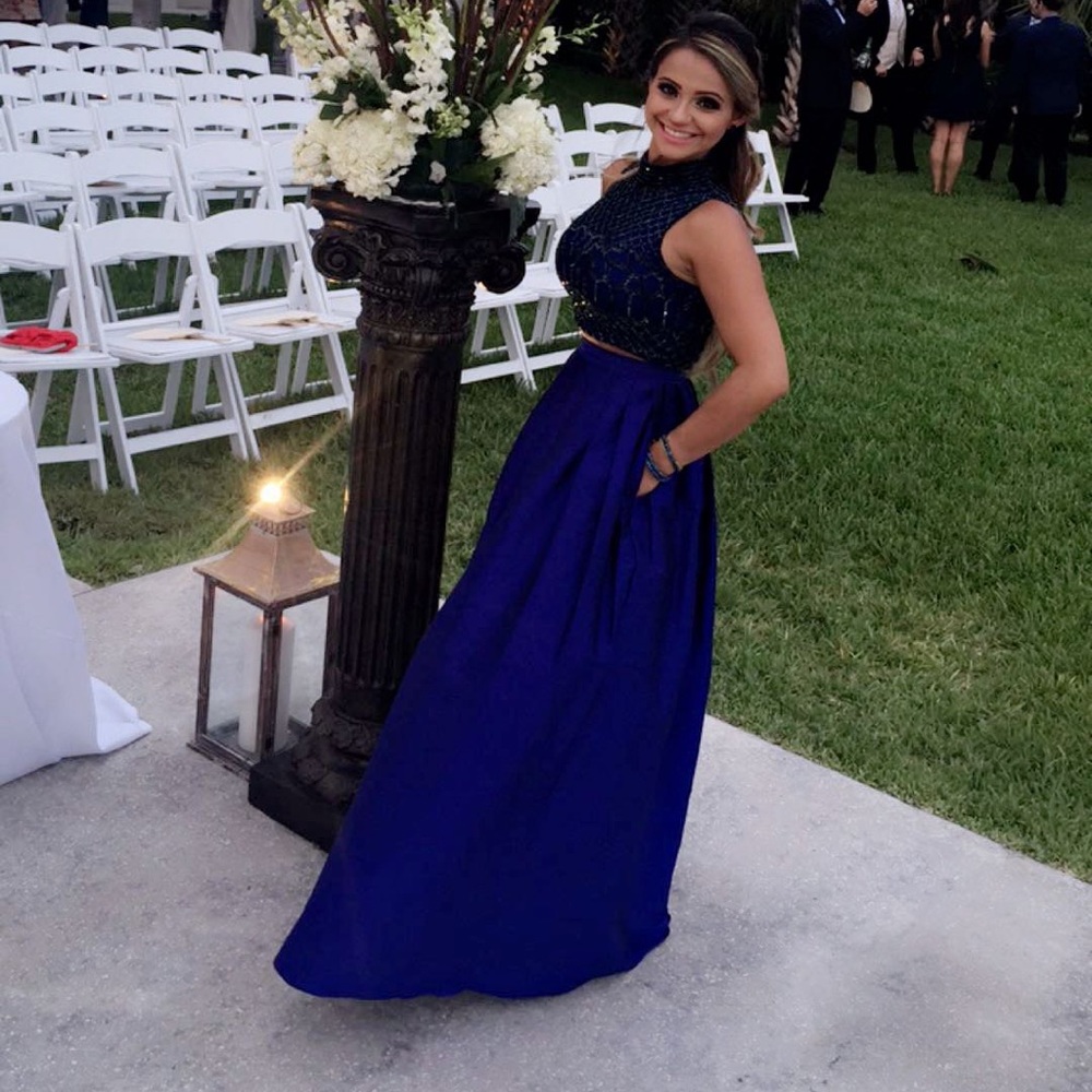 crop top , skirt dress and blue clutch